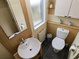 A bathroom with a sink and toilet at Reef Retreat in Little Haven