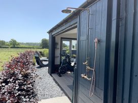 An outdoor shower and spinning bike at Ashlea Launceston