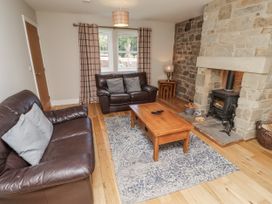 A living room with a sofa and a coffee table at Crispin in Lucker