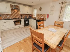 A kitchen with table and chairs at Crispin in Lucker