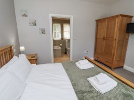 A bedroom with a bed and wardrobe at Crispin in Lucker