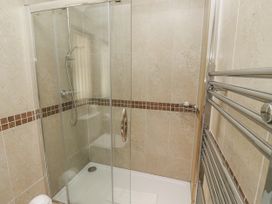 A bathroom with a shower and towel rail at Crispin in Lucker