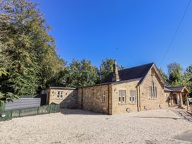 A building with windows and a gravel area at Crispin in Lucker