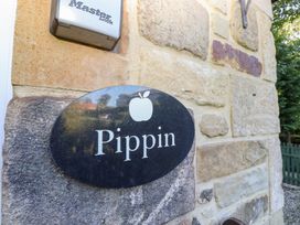 A sign reading Pippin on a stone wall at Pippin in Lucker