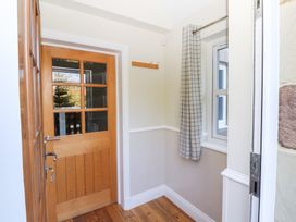 A hallway with a door and window at Pippin in Lucker