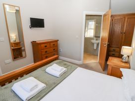 A bedroom with a bed and dresser at Pippin in Lucker