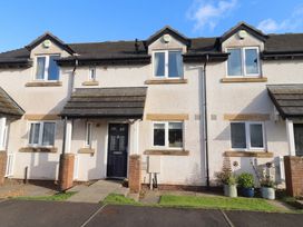 A house exterior with a door and windows at Ahoy in Seahouses