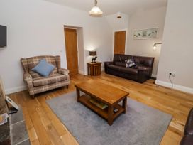 A living room with a coffee table and seating at Bramley in Lucker