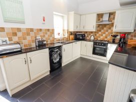 A kitchen with various appliances and cabinets at Bramley in Lucker