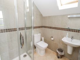 A bathroom with a shower, toilet, and sink at Bramley in Lucker