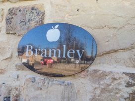 A sign with the name Bramley on a stone wall at Bramley in Lucker