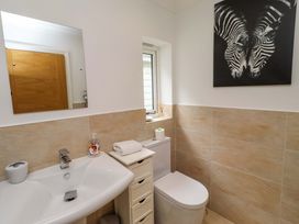 A bathroom with a sink and toilet at Farne Cottage Beadnell