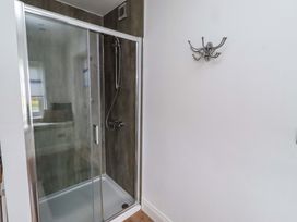 A shower enclosure in a bathroom at Farne Cottage in Beadnell