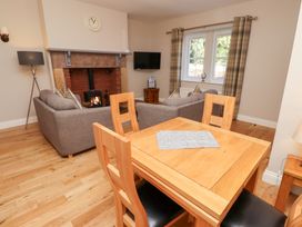 A living room with a sofa and a table at Russet in Lucker