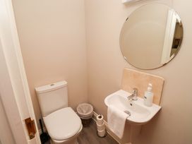 A bathroom with a toilet and sink at Russet in Lucker