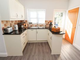 A kitchen with a sink and appliances at Russet in Lucker
