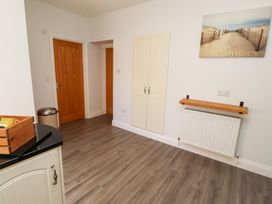 A kitchen with a shelf and radiator at Russet in Lucker