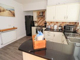 A kitchen with appliances and a countertop at Russet in Lucker