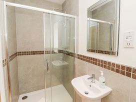 A bathroom with a shower and sink at Russet in Lucker