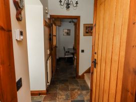 A hallway with tiles and a light fixture at No9 Budle Sands in Bamburgh