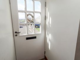 An entrance with a door and window at No9 Budle Sands in Bamburgh