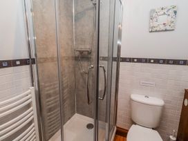 A bathroom with a shower and toilet at No9 Budle Sands in Bamburgh