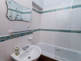 A bathroom with a sink and bathtub at No9 Budle Sands in Bamburgh