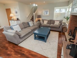 A living room with sofas and a coffee table at The Beach Hut Beadnell
