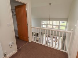 A landing with a door and a view of the outdoor area at The Beach Hut in Beadnell