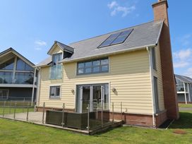 A house with solar panels and decking at The Beach Hut Beadnell