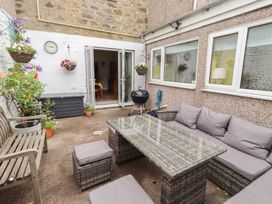 An outdoor area with seating and plants at Number Seventeen Amble