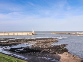 View of a pier and water at Cuddy's Holm in Seahouses