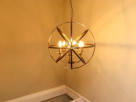 A chandelier with six lights at Coble Cottage in Craster