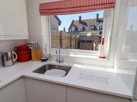A kitchen with a sink and countertop at Dunford Cottage in Bamburgh