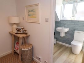 A bathroom with toilet and sink at Dunford Cottage Bamburgh