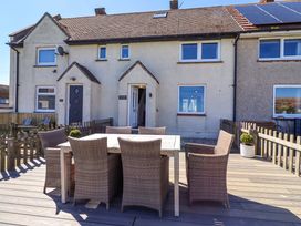 An outdoor area with a dining set in Dunford Cottage in Bamburgh