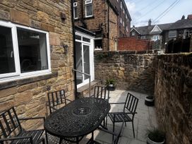 An outdoor area with a table and chairs at Longshore in Alnmouth