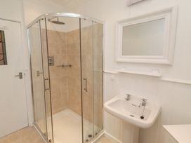 A bathroom with a shower and sink at Dell Point in Beadnell