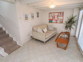 A living room with a sofa and coffee table at Dell Point in Beadnell