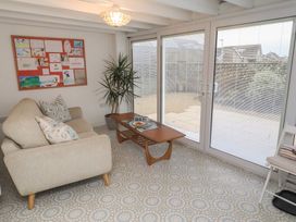 A snug with a sofa and coffee table at Dell Point in Beadnell