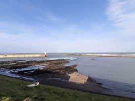 A view of the water and pier at Old Bakery No2 Seahouses