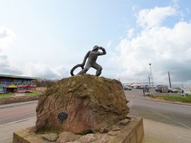 A statue of a person on a rock at The Old Bakery No2 in Seahouses