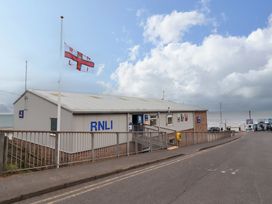 A building with RNLI signage near the beach at Old Bakery No2 Seahouses