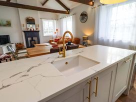 A kitchen with a sink and countertop at Treetops, Alnwick