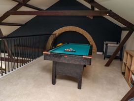A games room with a pool table and railing at Treetops, Alnwick