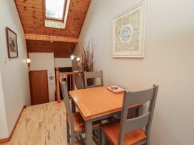 A dining area with a table and chairs at Links View in Embleton