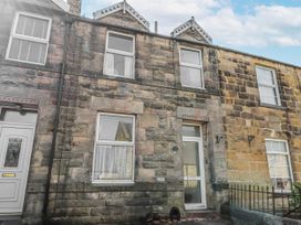 A stone building with a door and windows at Hardys House in Alnwick
