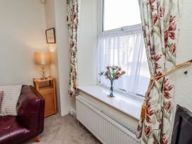 A living room with a sofa and lamp at Hardys House in Alnwick