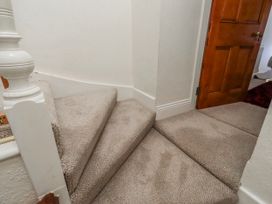 A staircase leading to a hallway at Hardys House Alnwick