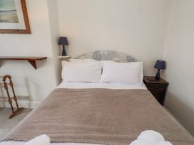 A bedroom with a bed and nightstand at Hardys House Alnwick